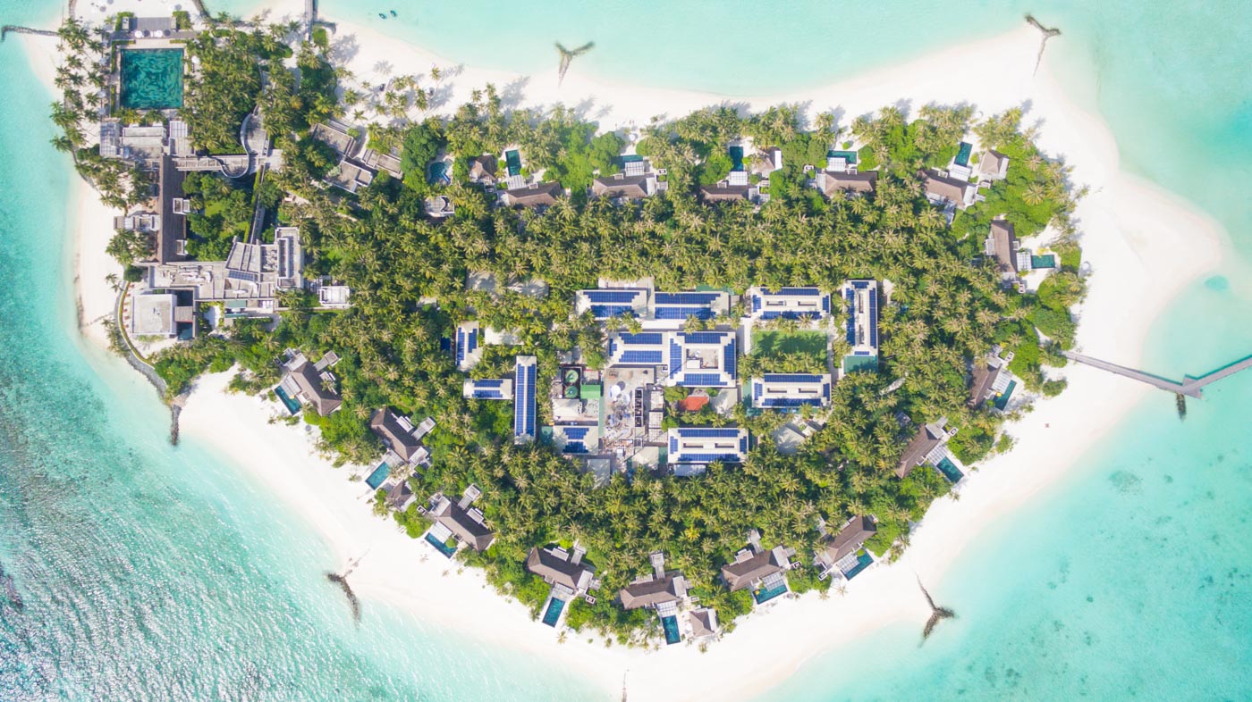Aerial overview of a Swimsol rooftop solar PV system on a private island resort