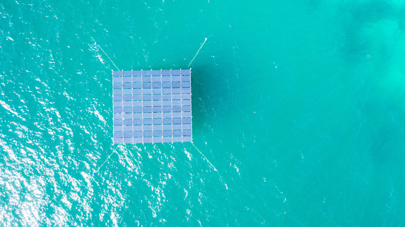 Top view of an offshore floating solar energy platform floating at a lagoon in the Maldives
