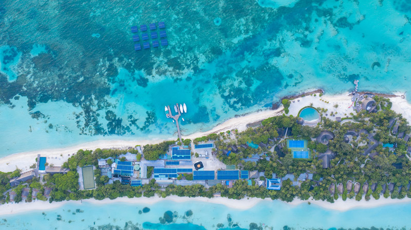 Aerial overview of Swimsol SolarSea and rooftop PV installation at LUX* Maldives