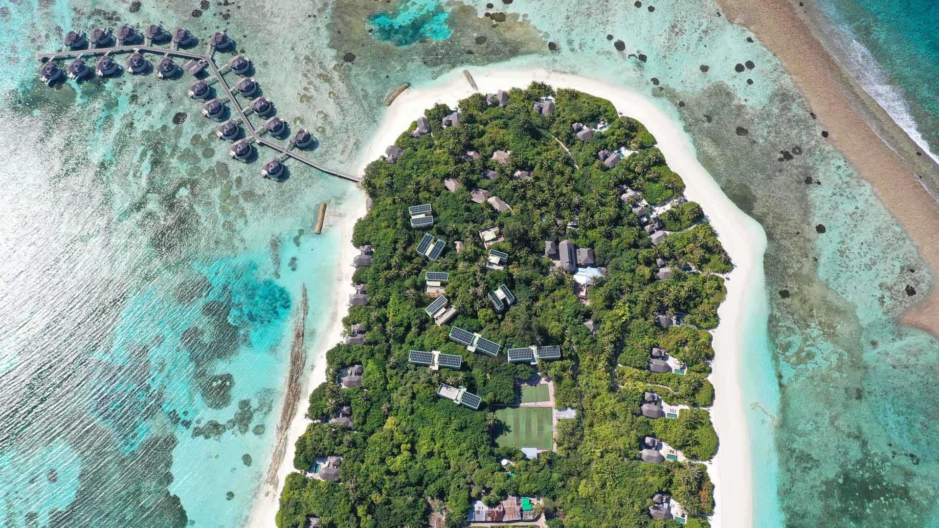 Aerial overview of a Swimsol Roofop Solar PV system on back of house buildings at Six Senses Laamu Maldives