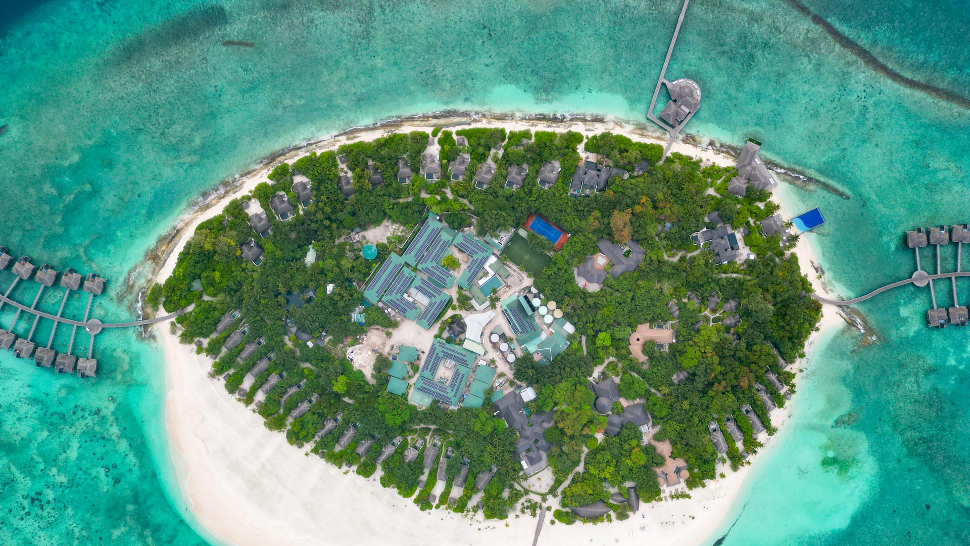 Aerial overview of rooftop solar pv system by Swimsol at at Ja Manafaru island Maldives