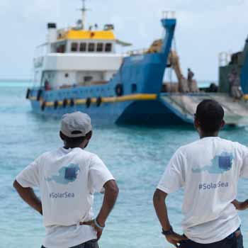 Swimsol staff watching a landing craft approach