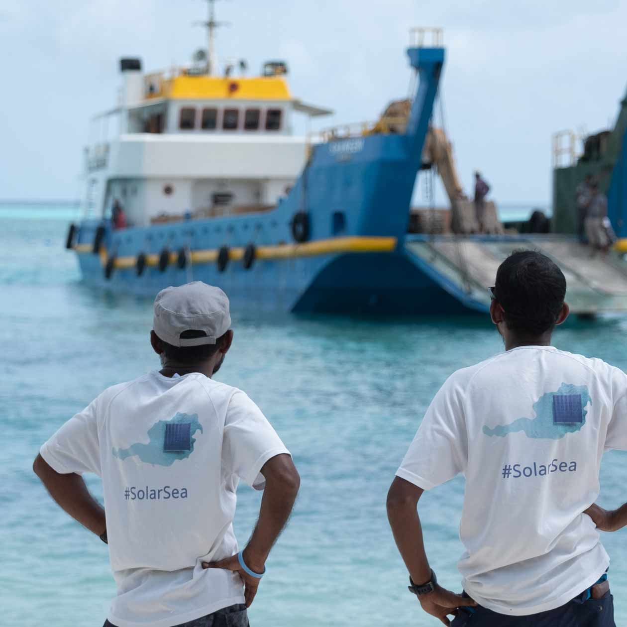 Solar installers watching a landing craft approach