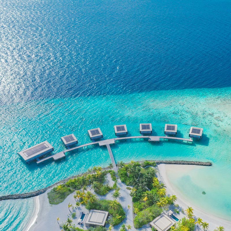 Beautiful solar power installation on water villas at Patina resort in the Maldives