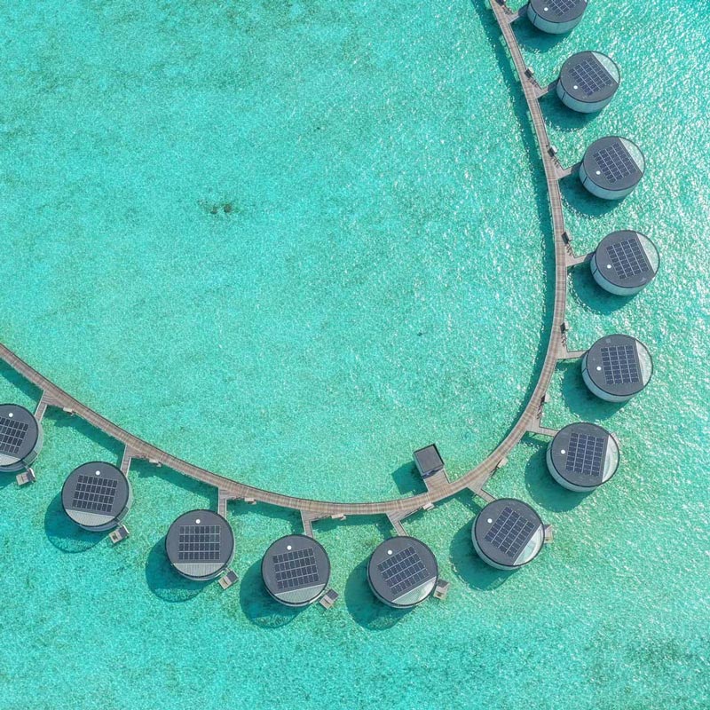 Beautiful solar panel installation on water villas at Ritz Carlton resort in the Maldives