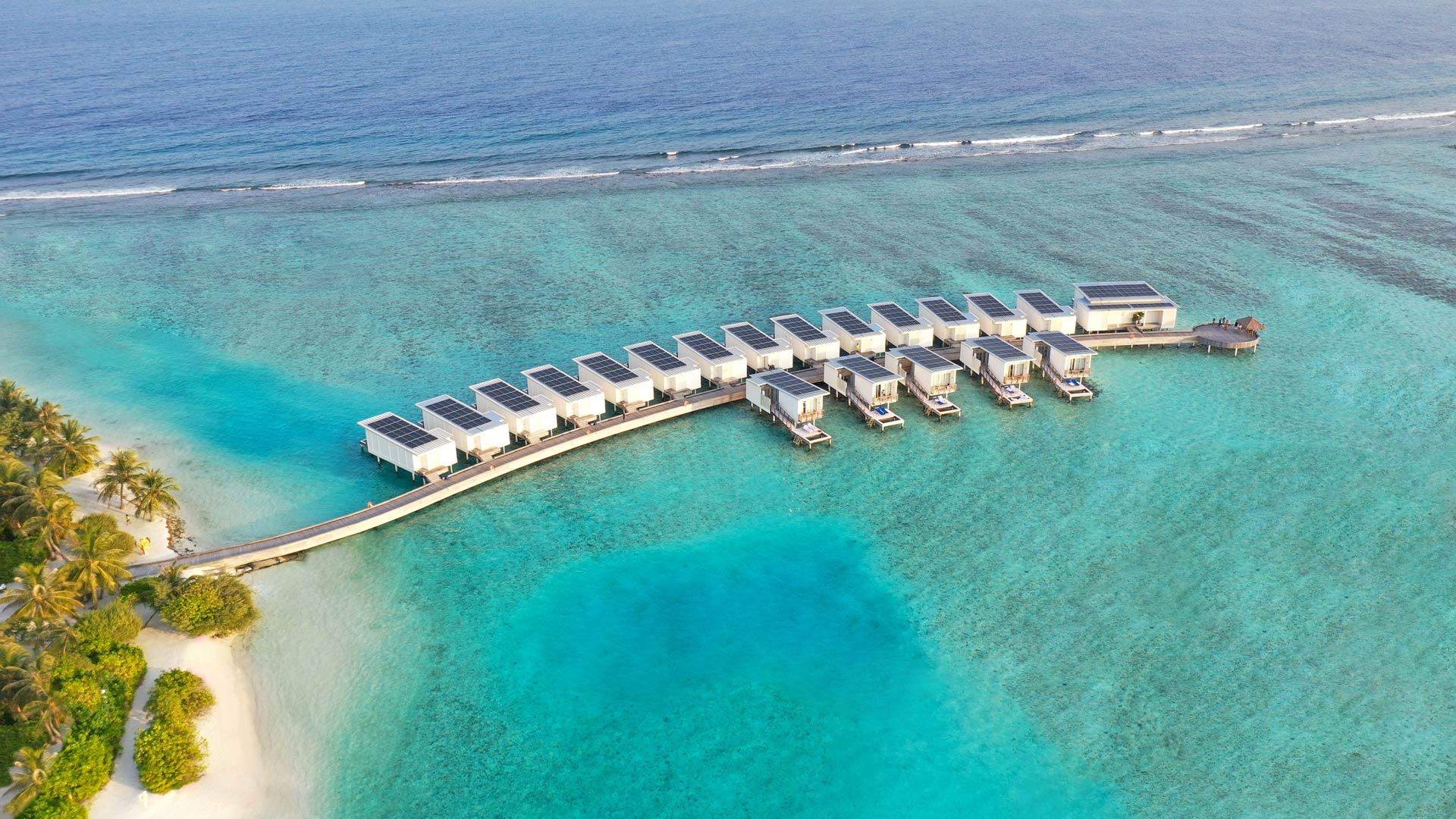 Beautiful Swimsol rooftop solar PV on water villas at Holiday Inn Kandooma Resort Island
